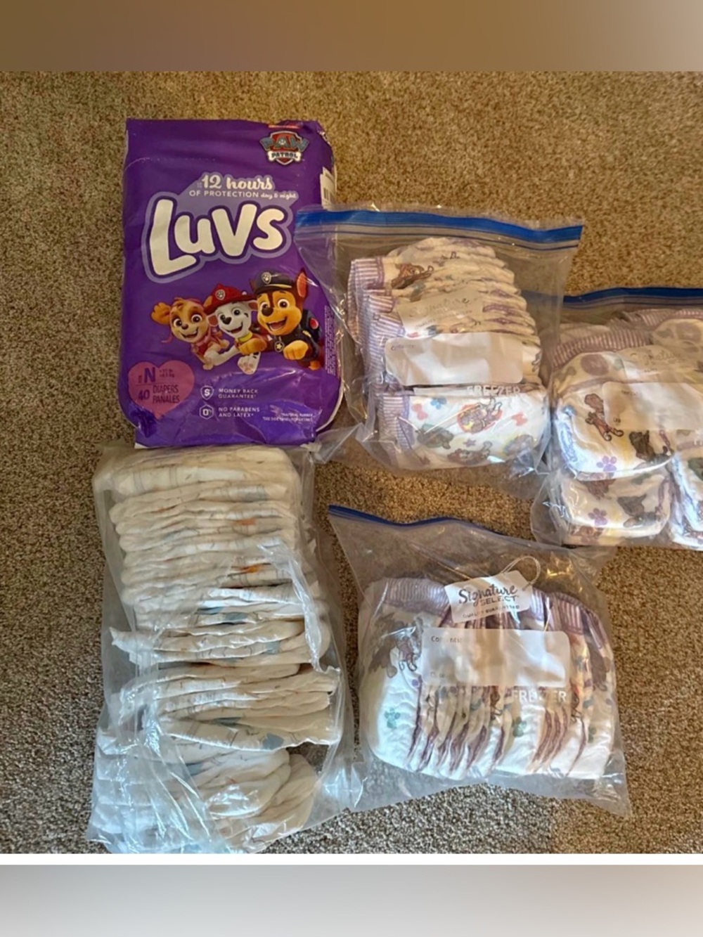 Luvs Baby Diapers and Huggies- new born size